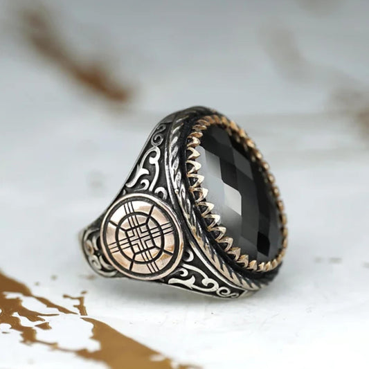 Faceted black onyx ring with bronze details in 925 sterling silver