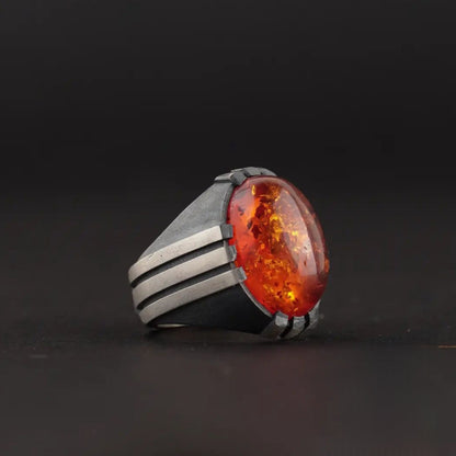 Herrenring aus Sterlingsilber mit feuerrotem Bernstein: Osmanisches Krallenmuster