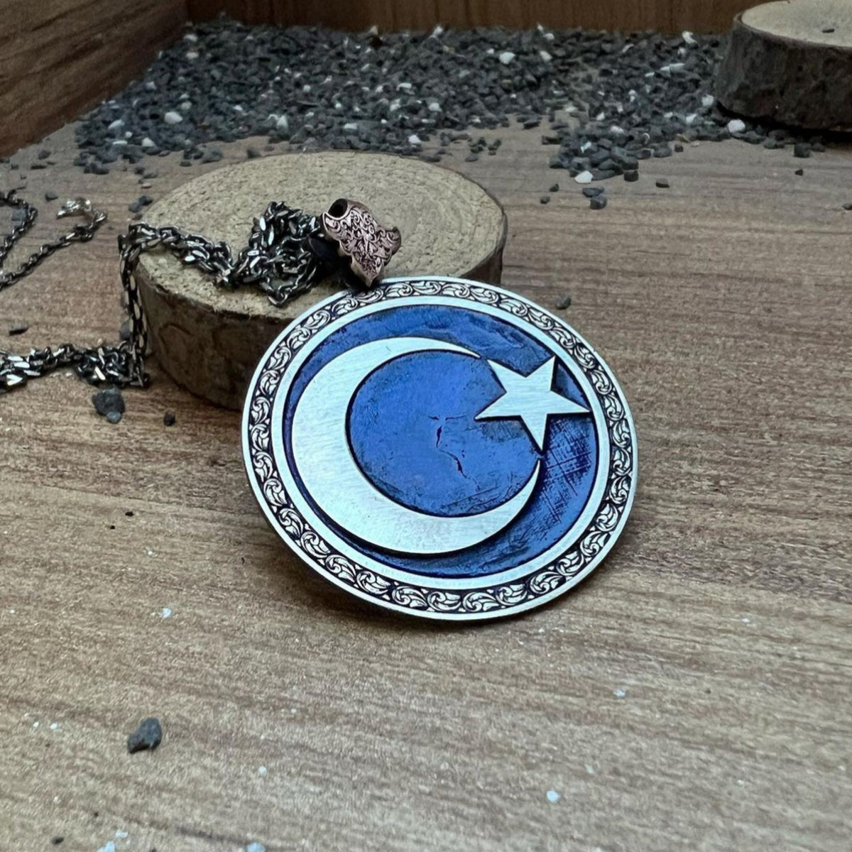 Moon and star medallion necklace on blue background – view 3