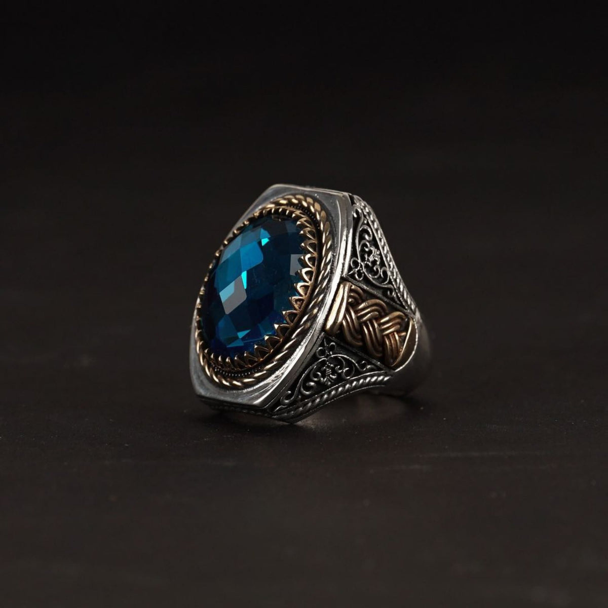 Facet-cut blue zircon ring – view 3