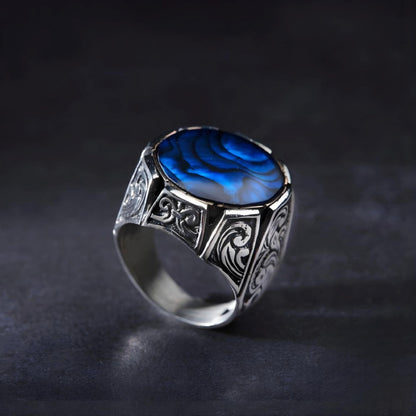 Handgefertigter Herrenring aus Sterlingsilber: Verstellbarer Meeresring mit blauem Bernstein